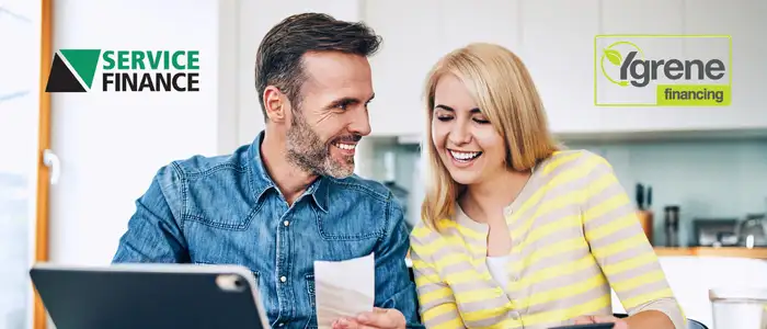 Homeowners reviewing roof financing options together